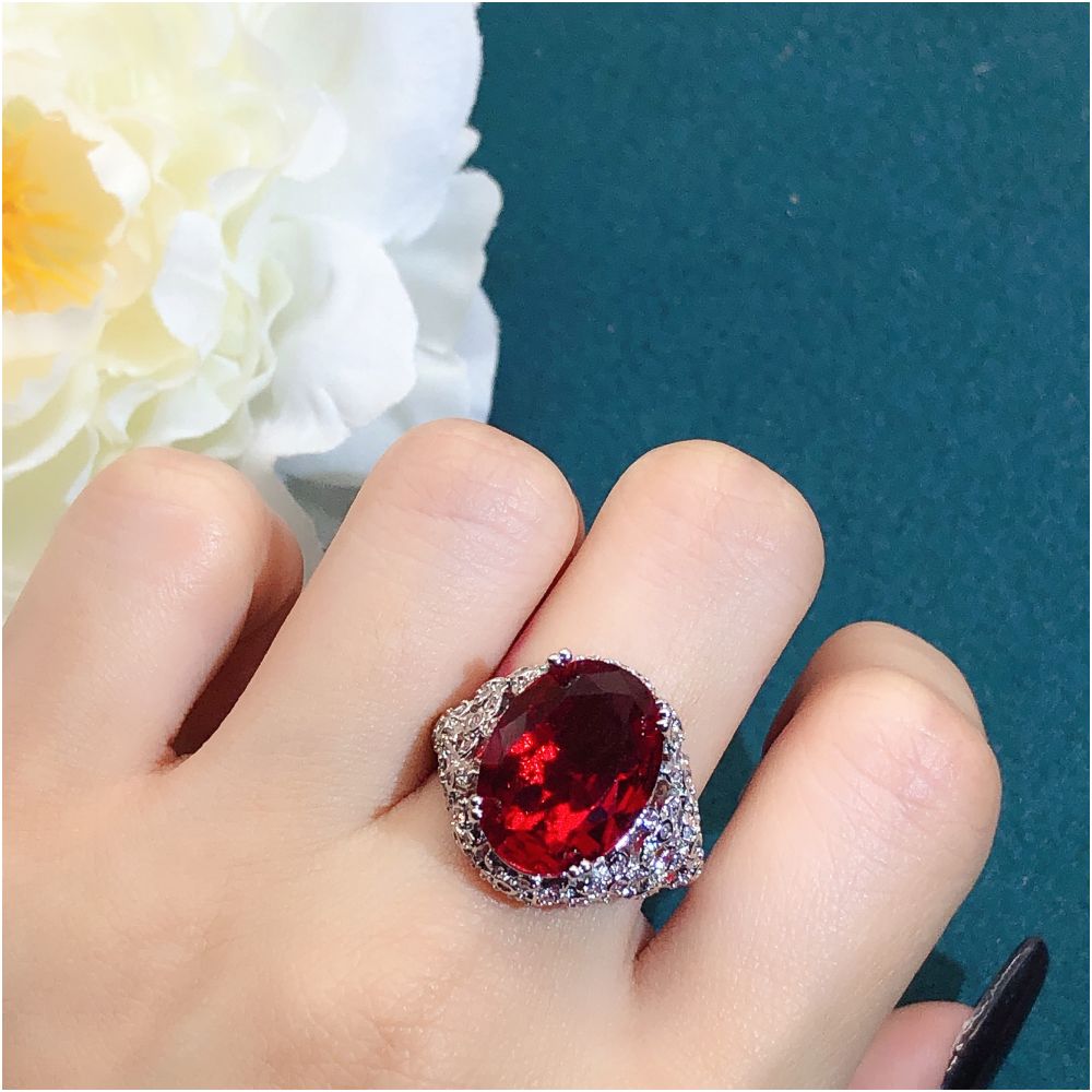 Youngever s new pigeon egg ruby ring for women s luxury high end mesh bottom design with side full of diamond colored treasures image 1