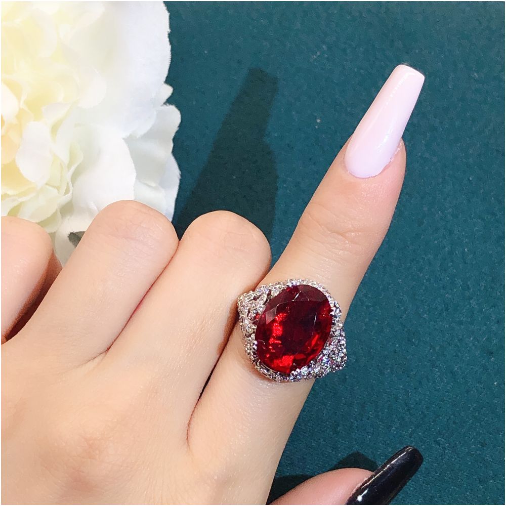 Youngever s new pigeon egg ruby ring for women s luxury high end mesh bottom design with side full of diamond colored treasures image 2