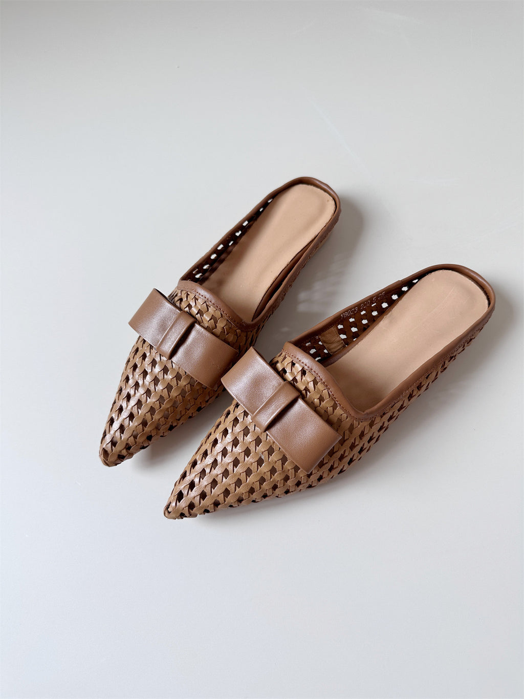 Woven leather flat half-slip sandals