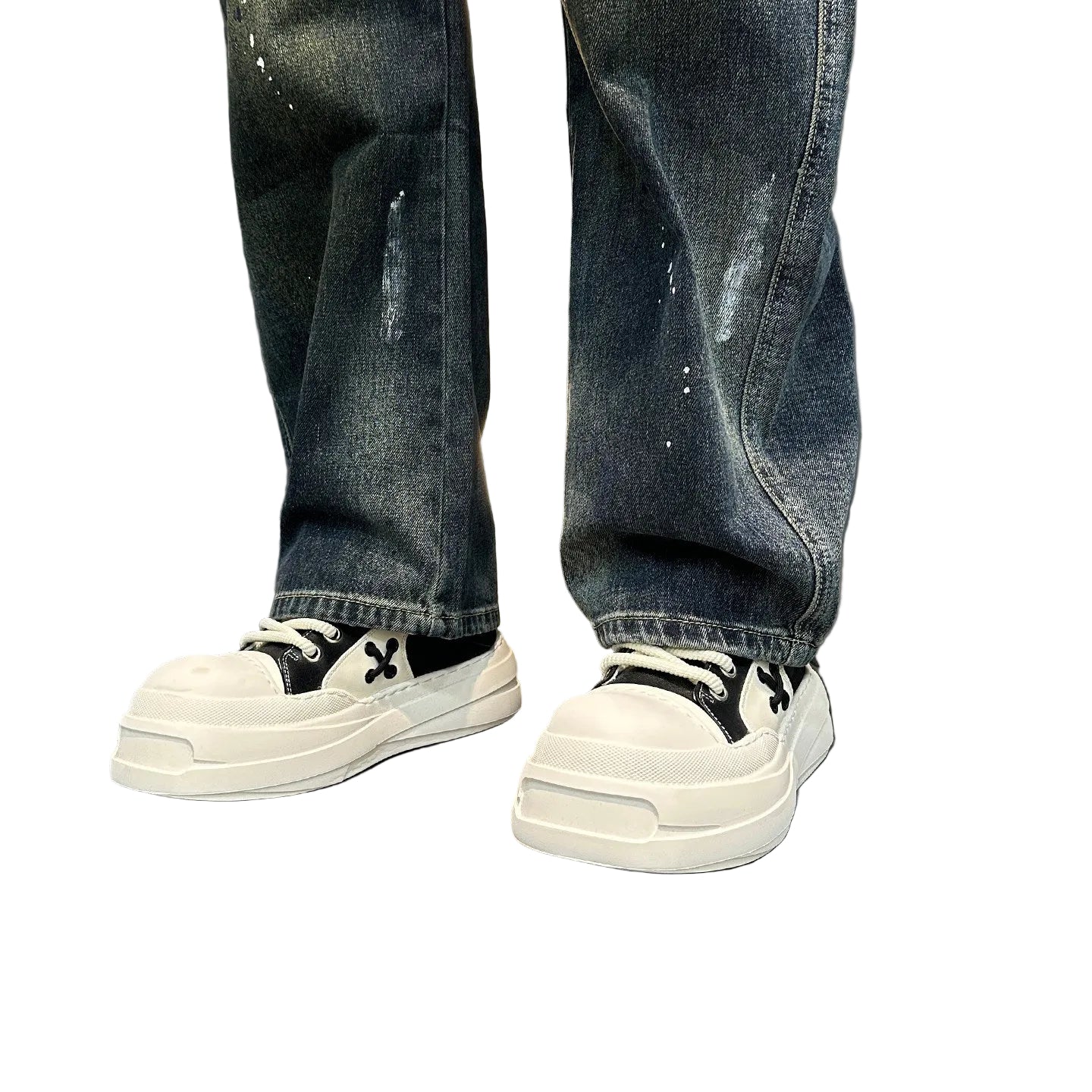 Distressed splashed ink jeans trousers