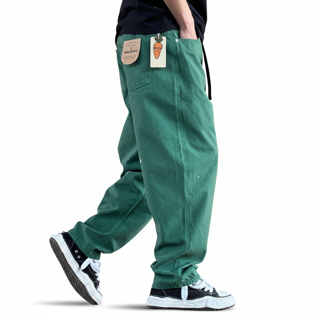 Distressed camouflage trousers bold paint-splatter accents pants