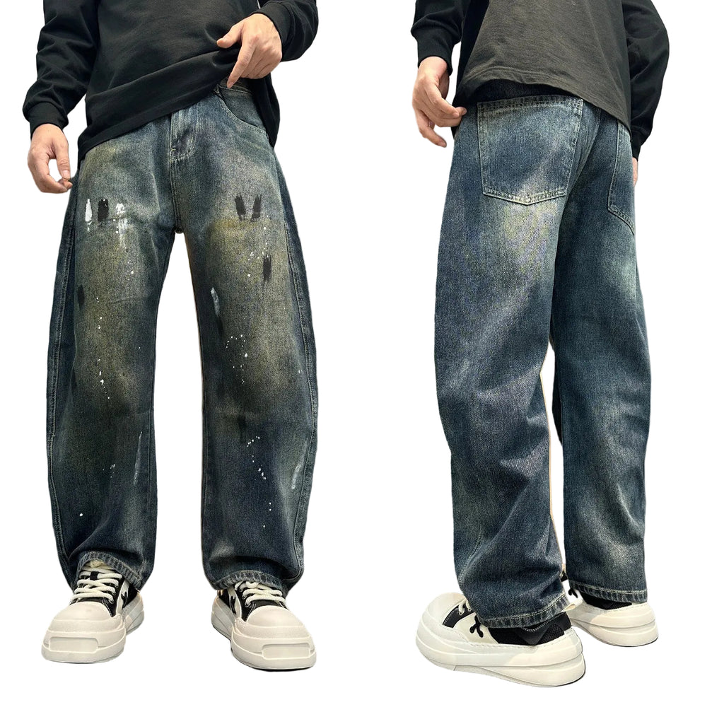 Distressed splashed ink jeans trousers