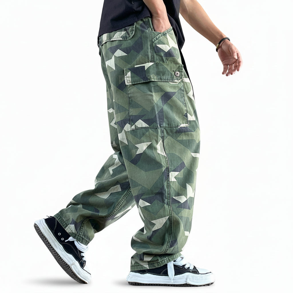 Distressed camouflage trousers bold paint-splatter accents pants