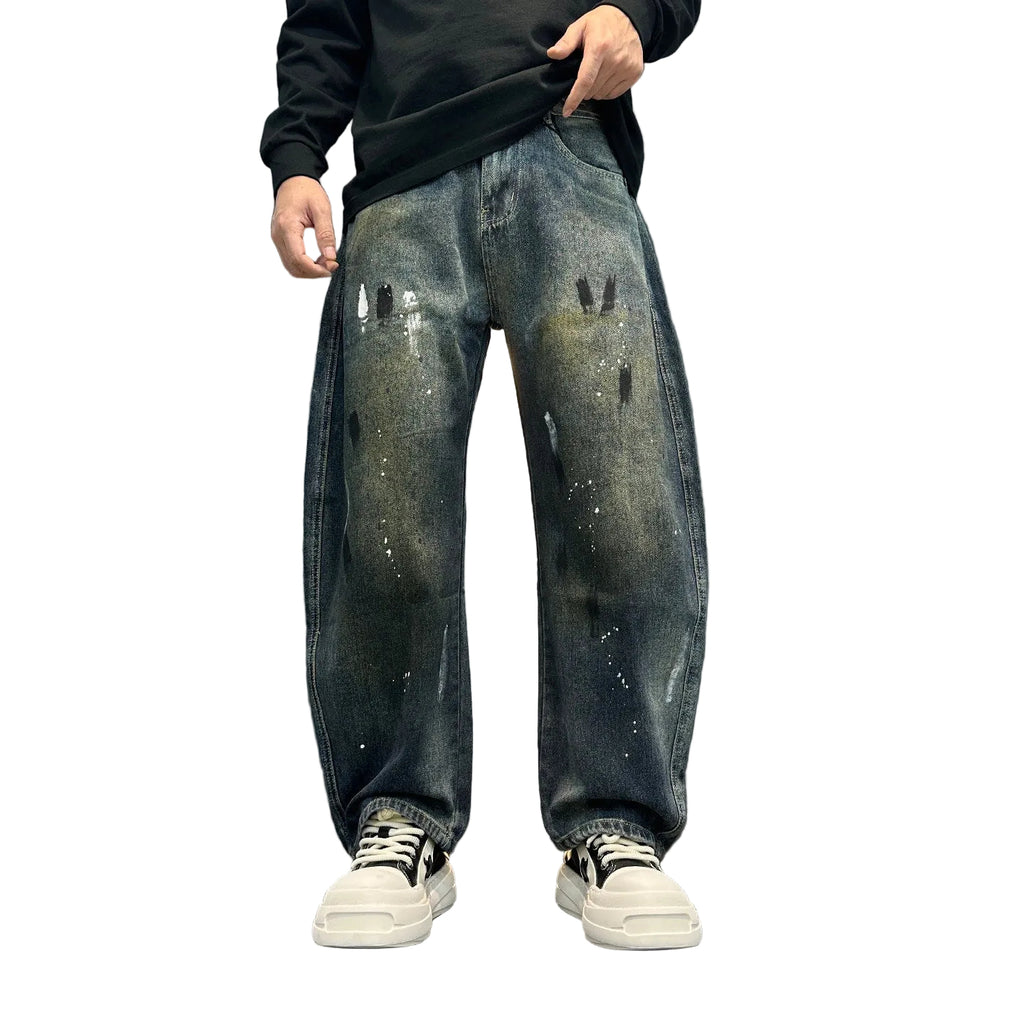 Distressed splashed ink jeans trousers
